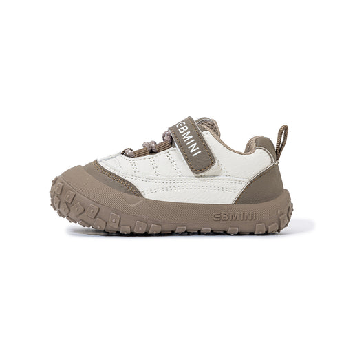 Side view of EBMINI BREEZE brown toddler sneaker with flexible segmented sole