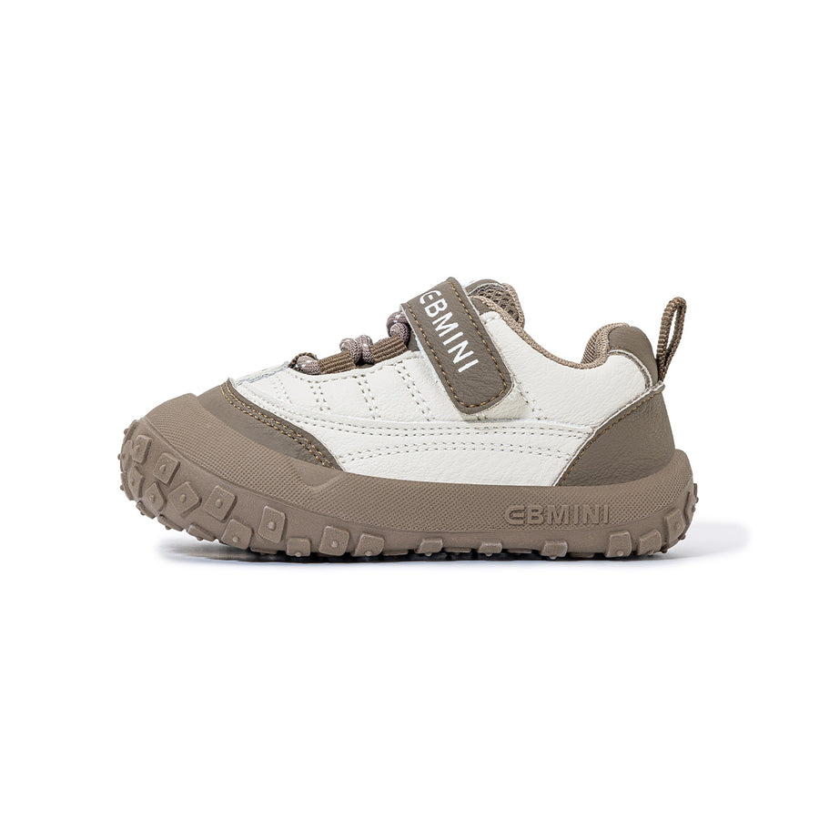 Side view of EBMINI BREEZE brown toddler sneaker with flexible segmented sole