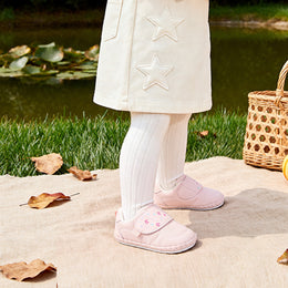 EBMINI CORDY baby shoe shown with the soft outsole bent by hand