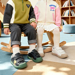 EBMINI COSMO child wearing the sneakers during active playground play