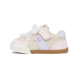 Pink EBMINI DOTE toddler sneaker side view with polka-dot panel and lace bow