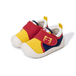 Pair of yellow EBMINI PICO first walker sneakers