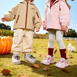 Child wearing EBMINI QUEST protective hiking sneakers outdoors