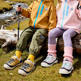 Children wearing yellow and purple EBMINI RIDGE hiking sneakers outdoors