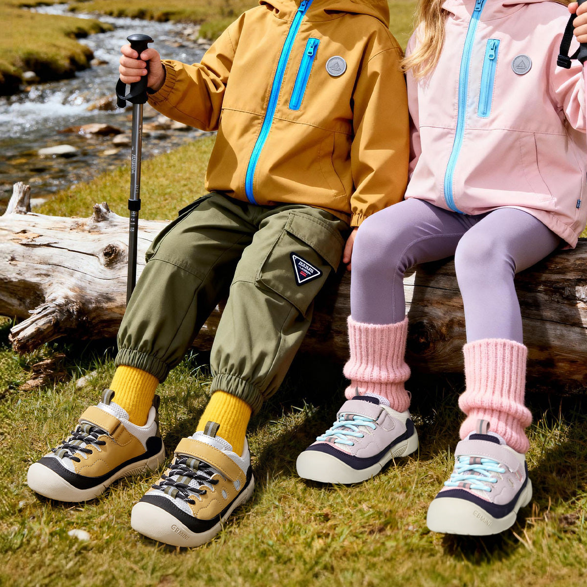 Children wearing yellow and purple EBMINI RIDGE hiking sneakers outdoors