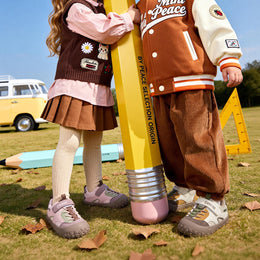 Children wearing pink and brown EBMINI ROVER toddler sneakers outdoors