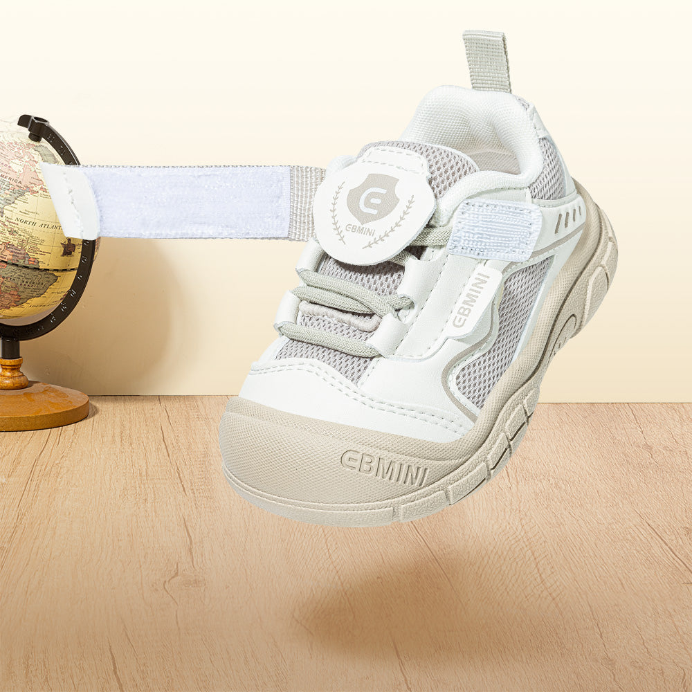 Close-up of EBMINI SHIELD badge strap and elastic lace closure