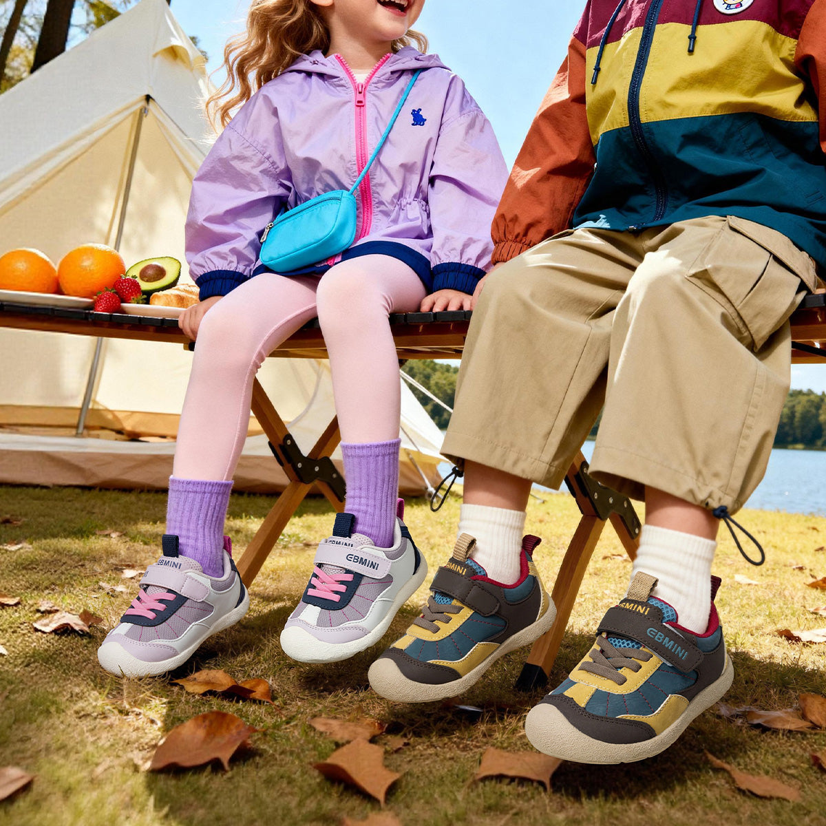 Child wearing purple EBMINI SKYPOP sneakers during playground play